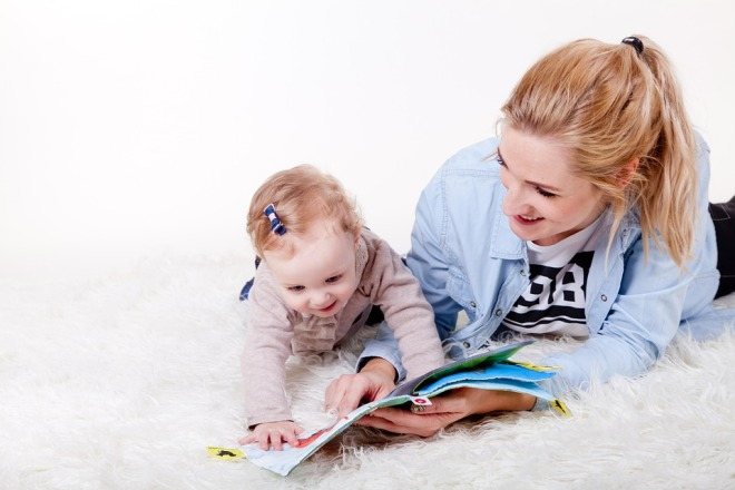 Mom and child looking at a book