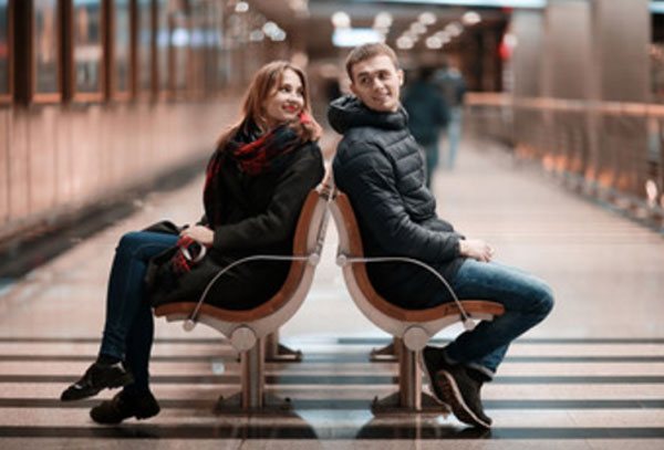 A guy meeting a girl at a metro station